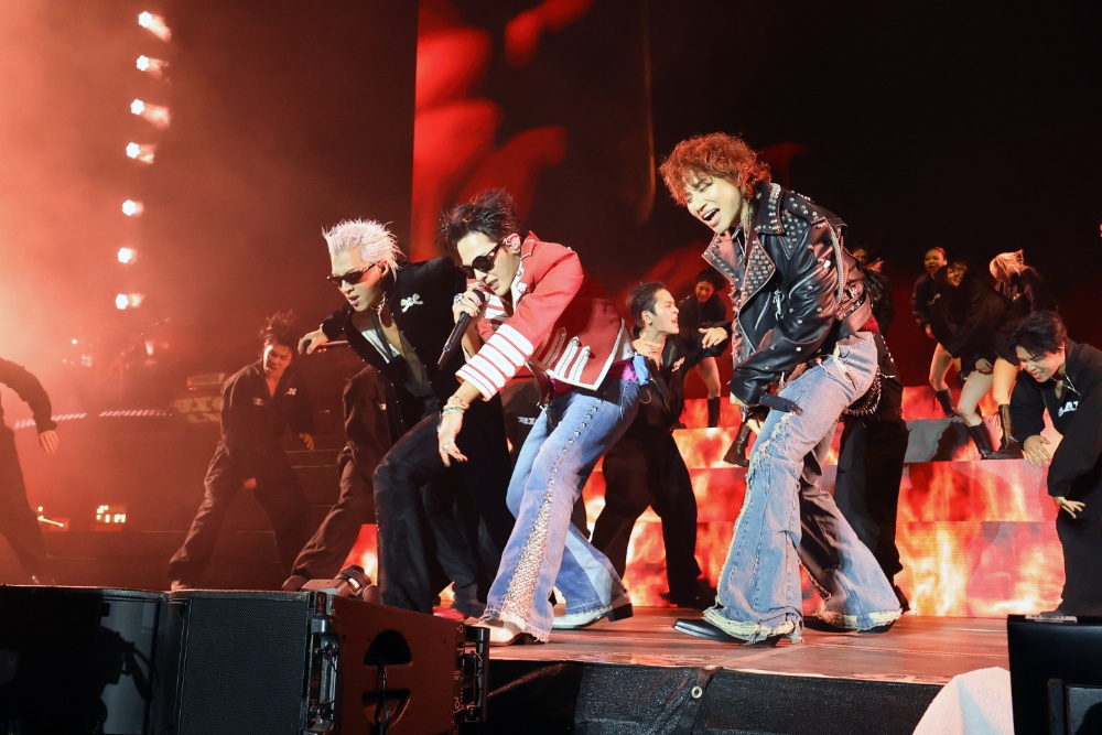 BIGBANG members perform on stage ahead of the 2026 world tour announcement featuring G-Dragon, Taeyang and Daesung.